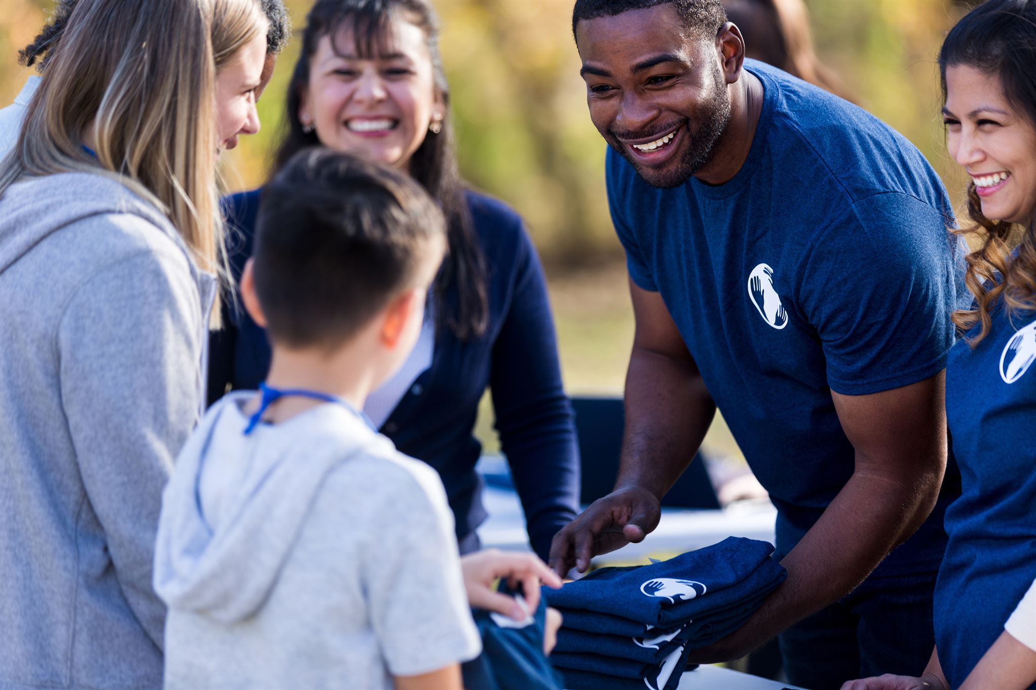 People-handing-out-shirts