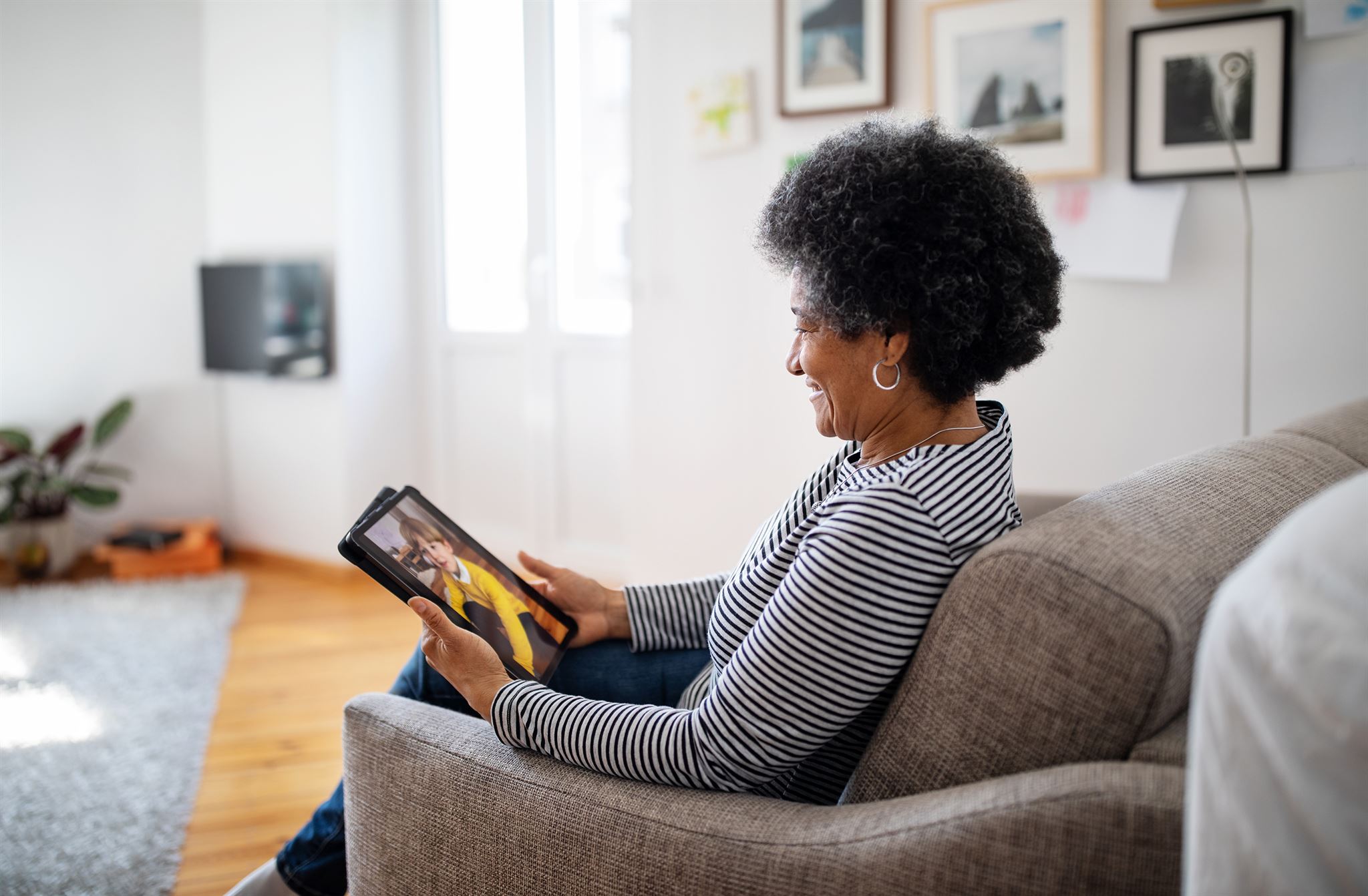 Person reading a newsletter on a digital tablet